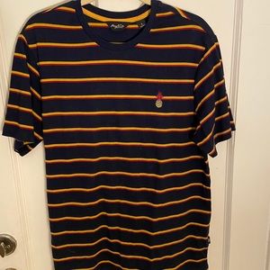 navy blue, red, and mustard yellow tee